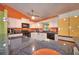 Bright kitchen showcasing granite countertops, white cabinets, tile floors, and modern appliances at 1131 Lemonwood Ave, Deland, FL 32724