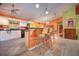 Bright kitchen with white cabinetry and bar seating at 1131 Lemonwood Ave, Deland, FL 32724