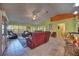 Spacious living area with tile floors, comfortable seating, and access to the kitchen at 1131 Lemonwood Ave, Deland, FL 32724