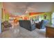 Open-concept living space with tile flooring and a seamless flow to the kitchen at 1131 Lemonwood Ave, Deland, FL 32724