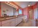 The bright main bathroom includes double vanities, a soaking tub, and modern lighting at 1131 Lemonwood Ave, Deland, FL 32724