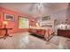 The spacious main bedroom is bright with a colorful quilt and lots of light at 1131 Lemonwood Ave, Deland, FL 32724