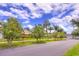 Charming home with solar panels, lush trees, manicured lawn and blooming plants at 1131 Lemonwood Ave, Deland, FL 32724
