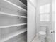 Small toilet room with shelves for storage at 1155 Taylor E Rd, Deland, FL 32724