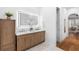 Bathroom featuring a double sink vanity, wood cabinet, and illuminated mirror at 1155 Taylor E Rd, Deland, FL 32724