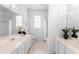 Bright bathroom features dual sinks, marble countertops, and a shower-tub combo at 1155 Taylor E Rd, Deland, FL 32724