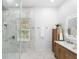 Bathroom with a frameless glass shower and a vanity with natural wood at 1155 Taylor E Rd, Deland, FL 32724