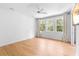 Spacious bedroom featuring a large window, ceiling fan, and wood-look flooring at 1155 Taylor E Rd, Deland, FL 32724