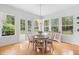 Bright dining room with decorative chandelier and views of the landscaped backyard at 1155 Taylor E Rd, Deland, FL 32724