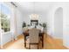 Elegant dining room with hardwood floors, chandelier, and plenty of natural light at 1155 Taylor E Rd, Deland, FL 32724