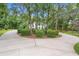Long circular driveway leading to a luxurious home surrounded by lush greenery at 1155 Taylor E Rd, Deland, FL 32724