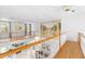 Open floor plan features second-story hall with white railings overlooking living area with mural at 1155 Taylor E Rd, Deland, FL 32724