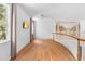 This bright hallway features wood-look flooring and a mural at 1155 Taylor E Rd, Deland, FL 32724