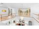 Open floor plan features second-story hall with white railings overlooking living area with mural at 1155 Taylor E Rd, Deland, FL 32724