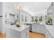 This stylish kitchen is equipped with stainless steel appliances, a large island, and backyard views at 1155 Taylor E Rd, Deland, FL 32724