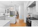 This contemporary kitchen offers white cabinetry, modern appliances, and a breakfast nook with backyard views at 1155 Taylor E Rd, Deland, FL 32724