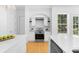This modern kitchen has stainless steel appliances, subway tile backsplash, and plenty of counter space at 1155 Taylor E Rd, Deland, FL 32724