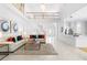 Open-concept living room with high ceilings, flowing to the kitchen and front entry at 1155 Taylor E Rd, Deland, FL 32724