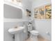 Stylish powder room with stained glass accent window, perfect for guests at 1155 Taylor E Rd, Deland, FL 32724