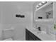 Contemporary bathroom featuring a lighted mirror and updated fixtures at 1214 Flomich St, Daytona Beach, FL 32117