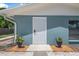 Inviting front door with well manicured plants, creating a warm entrance to this beautiful home at 1214 Flomich St, Daytona Beach, FL 32117