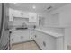 Beautiful kitchen with stainless steel sink, modern countertop and white cabinetry offering style and functionality at 1214 Flomich St, Daytona Beach, FL 32117