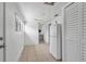 An open kitchen space with tile flooring, white fridge and closet, and an exterior door at 1214 Flomich St, Daytona Beach, FL 32117