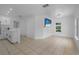 Bright living room with tile flooring, neutral walls, and modern fixtures offer a cozy and inviting space at 1214 Flomich St, Daytona Beach, FL 32117