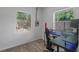 Bright room featuring wood look floors and two windows at 1214 Flomich St, Daytona Beach, FL 32117