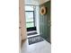 Welcoming foyer showcases a green door, gray welcome mat, and tiled flooring at 1216 August Sky Dr, Deltona, FL 32738
