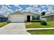 Charming single-story home with a well-manicured lawn and attached two-car garage in a desirable neighborhood at 1216 August Sky Dr, Deltona, FL 32738