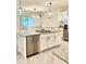 Modern kitchen with granite countertops, stainless steel appliances, and a large island with a sink and dishwasher at 1216 August Sky Dr, Deltona, FL 32738