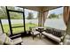 Relaxing screened lanai with comfortable seating and views of the backyard at 1216 August Sky Dr, Deltona, FL 32738