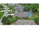 Aerial view of properties with a screened pool at 1329 Sunningdale Ln, Ormond Beach, FL 32174