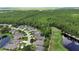 Aerial shot of homes nestled in a serene community next to a beautiful golf course and pond at 1329 Sunningdale Ln, Ormond Beach, FL 32174