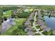 Stunning aerial view of a golf course community with waterfront homes and lush greenery at 1329 Sunningdale Ln, Ormond Beach, FL 32174