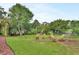 A well-maintained lawn and landscaping create an inviting backyard at 1329 Sunningdale Ln, Ormond Beach, FL 32174