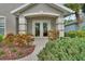 Inviting entryway with double doors and neatly manicured landscaping creating curb appeal at 1329 Sunningdale Ln, Ormond Beach, FL 32174