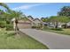 Charming home featuring a well-manicured lawn and a welcoming two-car garage, set in a lush landscape at 1329 Sunningdale Ln, Ormond Beach, FL 32174