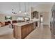 Spacious open-concept kitchen featuring a large island and modern appliances and opens up to a cozy living space at 1329 Sunningdale Ln, Ormond Beach, FL 32174