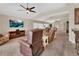 Spacious living room with vaulted ceilings, neutral carpeting, comfortable seating, and a media center at 1329 Sunningdale Ln, Ormond Beach, FL 32174