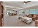Bright, expansive living room featuring neutral decor, large windows, and high ceilings at 1329 Sunningdale Ln, Ormond Beach, FL 32174