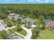 Beautiful aerial view of the property showcasing the home's lush landscaping, and screened pool at 15 Cambridge Trce, Ormond Beach, FL 32174
