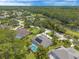 A high angle view displays many residences near a green space and a powerline corridor at 15 Cambridge Trce, Ormond Beach, FL 32174