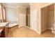 Bathroom featuring tiled flooring, a shower, a tub and a toilet at 15 Cambridge Trce, Ormond Beach, FL 32174