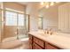 Bathroom with glass enclosed shower over tub, a large vanity and beautiful fixtures at 15 Cambridge Trce, Ormond Beach, FL 32174