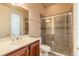Bathroom showcasing a glass enclosed shower, vanity and large mirror at 15 Cambridge Trce, Ormond Beach, FL 32174