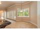 Bright breakfast nook boasting a bay window with views and access to a screened lanai at 15 Cambridge Trce, Ormond Beach, FL 32174