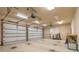 Spacious three-car garage with multiple garage doors and plenty of room for parking and storage at 15 Cambridge Trce, Ormond Beach, FL 32174