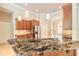 Well-appointed kitchen featuring granite countertops, a stainless-steel fridge, and a stylish faucet at 15 Cambridge Trce, Ormond Beach, FL 32174